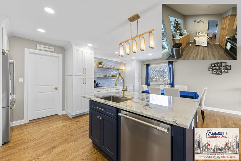 Kitchen remodel in Lombard IL with navy island, marble countertop, gold faucet, white shaker cabinets, and open dining area by Abbott Builders Inc.