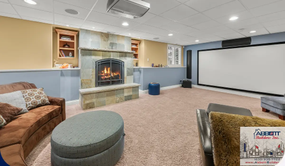 Finished basement remodeling media room with projector, fireplace, and recessed lighting for added home value.