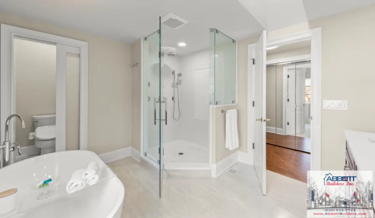 Bathroom remodeling project featuring a glass shower, bathtub, tile flooring, modern fixtures, and bright neutral finishes.